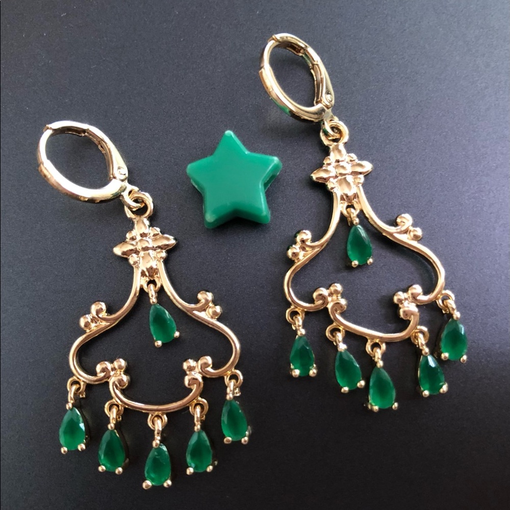 Gorgeous gold plated chandelier earrings with green jewels.